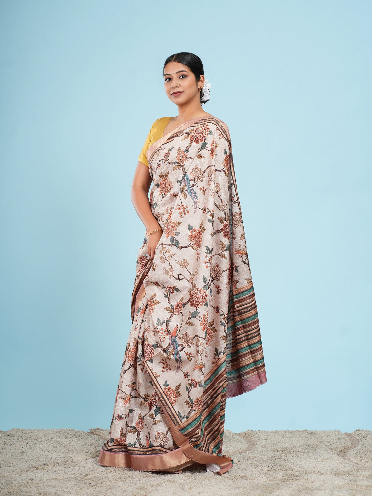 Soft beige self-jacquard saree draped full-length, showing pleat width and fall — Koshnika