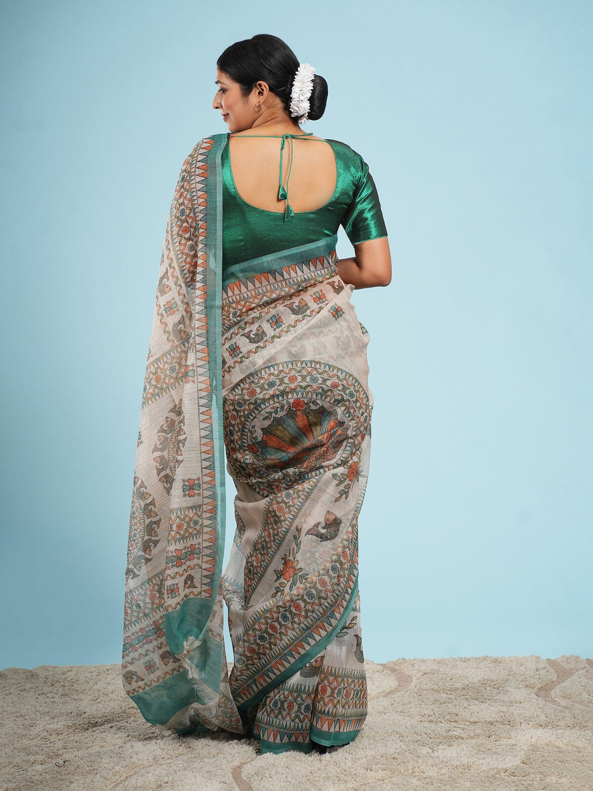 Ivory Tussar silk saree with a Madhubani-inspired border, showing drape and fall — Koshnika