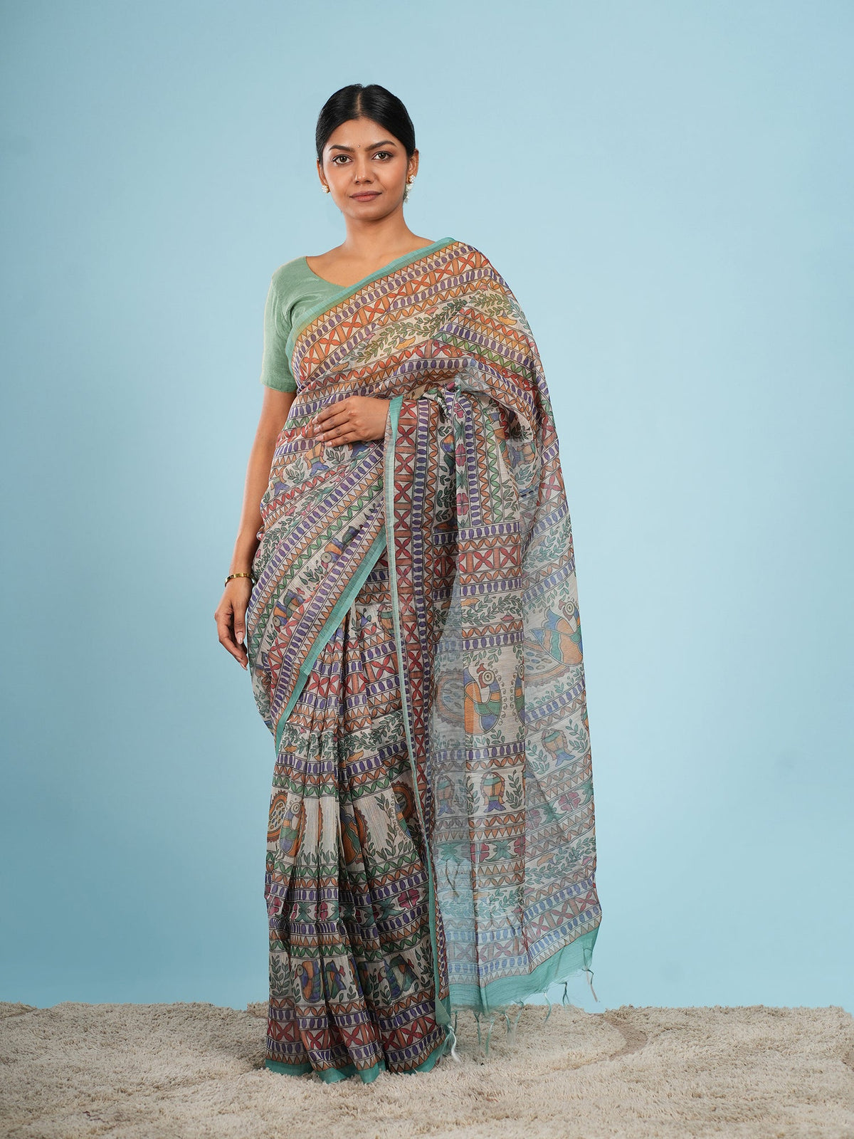Ivory Tussar silk saree draped, showing the slubbed surface that explains why tussar silk is expensive to produce — Koshnika