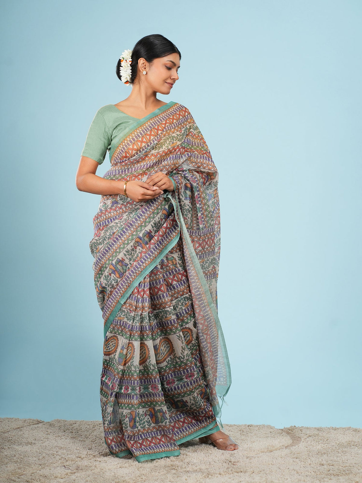 Ivory Tussar silk saree in a full-length drape, worn for a daytime summer function — Koshnika