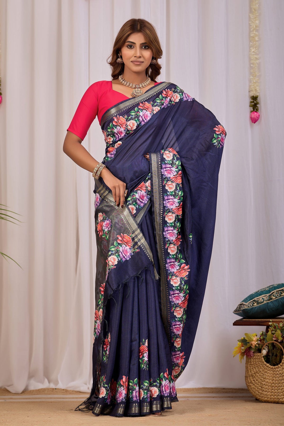Navy blue banana silk saree with Tanjore-inspired rose print and gold zari edge, draped full-length — Koshnika